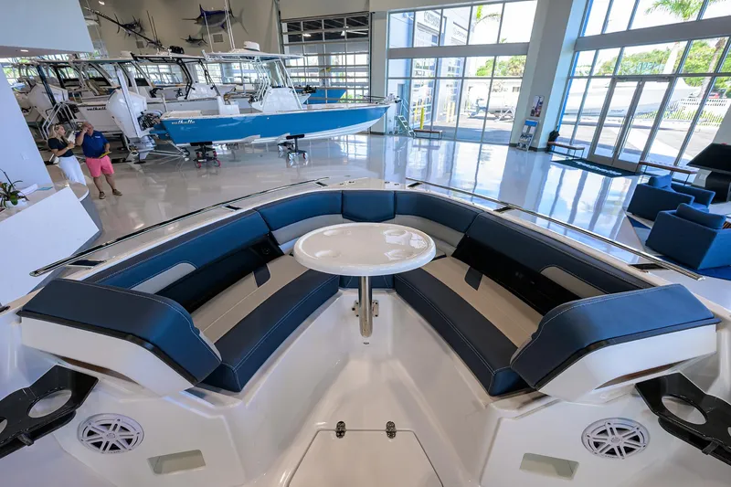 Slide: The Image of Interior view of 2026 Monterey Elite 27 OB boat with seating and table. - 17