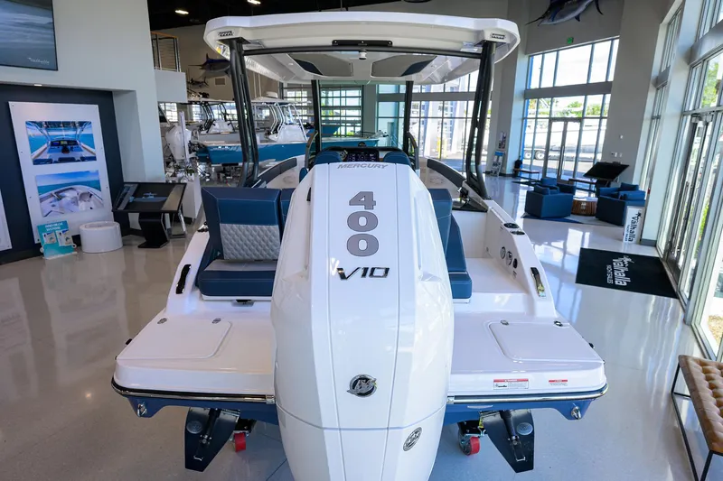 Slide: The Image of 2026 Monterey Elite 27 OB boat with Mercury 400 V10 engine in showroom. - 25