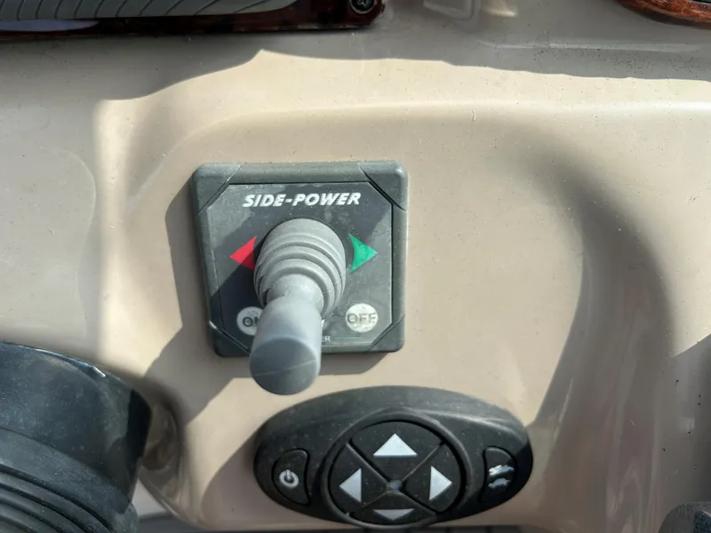 Slide: The Image of Control panel of a 2005 Sea Ray 300 Sundancer boat with Side-Power joystick. - 11