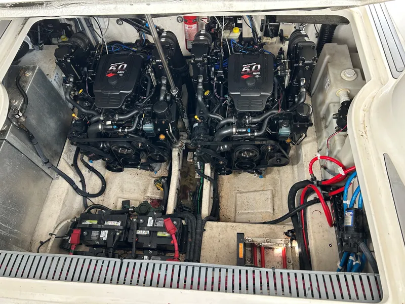Slide: The Image of Engine compartment of a 2005 Sea Ray 300 Sundancer with dual engines and wiring. - 20