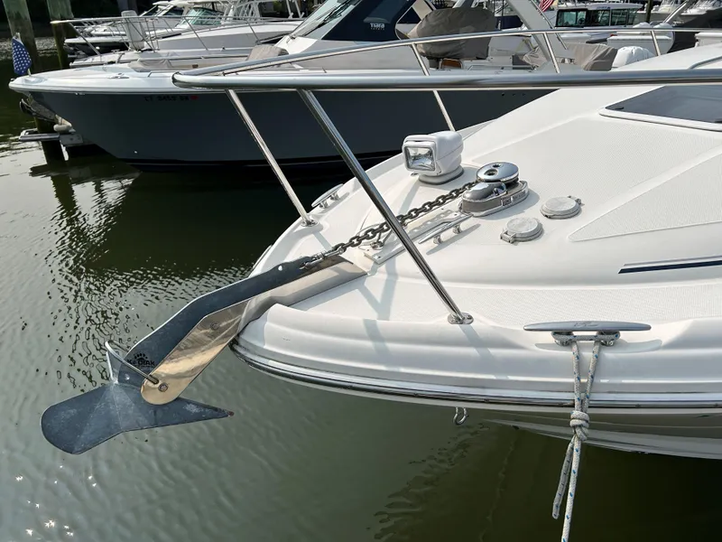 Slide: The Image of 2005 Sea Ray 300 Sundancer boat with anchor, docked in marina. - 5