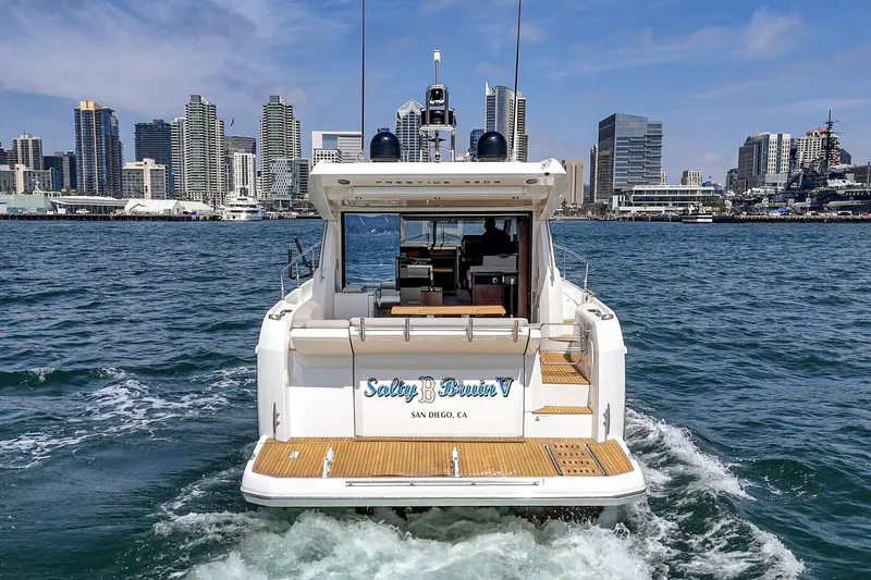 Slide: The Image of 2019 Prestige 520S yacht cruising near city skyline, San Diego. - 10