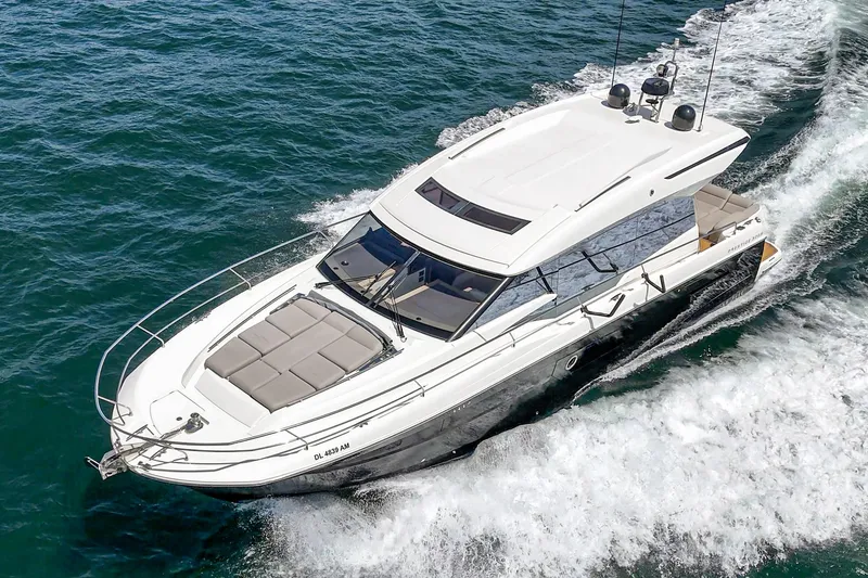 Slide: The Image of 2019 Prestige 520S yacht cruising on open water, showcasing sleek design and luxury features. - 11