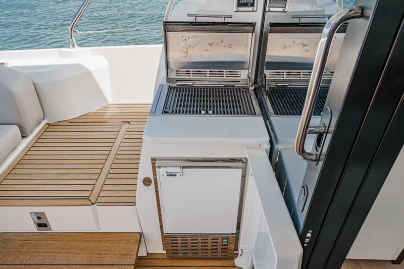 Slide: The Image of 2019 Prestige 520S yacht deck with grill and seating area. - 17