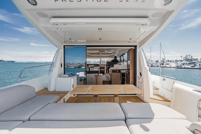Slide: The Image of Luxurious 2019 Prestige 520S yacht interior with spacious seating and ocean view. - 19