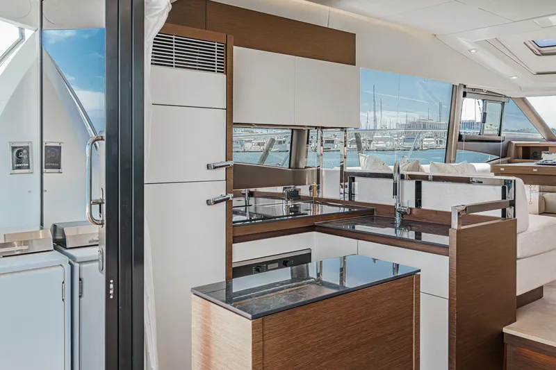 Slide: The Image of Luxurious interior of 2019 Prestige 520S yacht with modern kitchen and panoramic windows. - 21