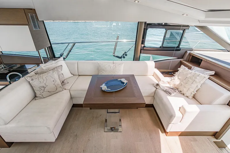 Slide: The Image of Luxurious interior of 2019 Prestige 520S yacht with elegant seating and wooden table. - 29