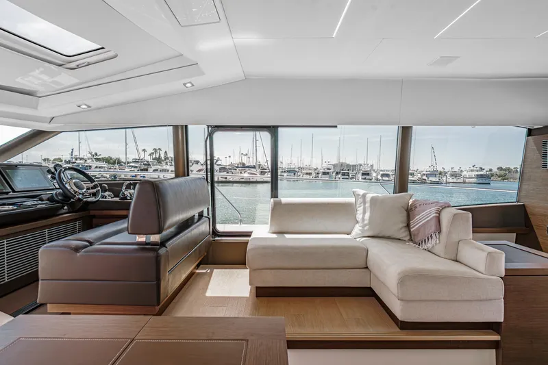 Slide: The Image of Luxurious interior of 2019 Prestige 520S yacht with elegant seating and marina view. - 32