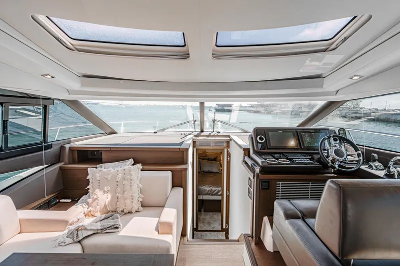 Slide: The Image of Luxurious interior of 2019 Prestige 520S yacht with modern helm and comfortable seating. - 33