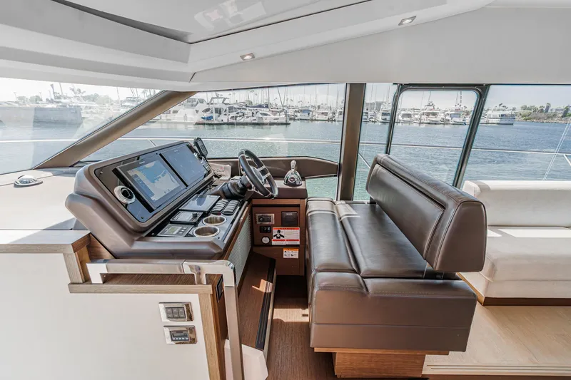 Slide: The Image of Luxurious 2019 Prestige 520S yacht interior with modern helm and leather seating. - 35