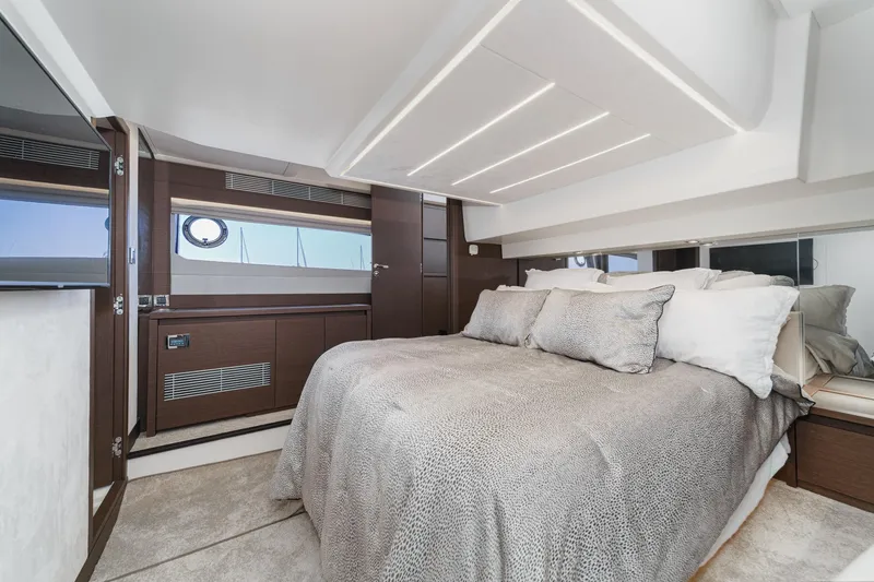 Slide: The Image of Luxurious bedroom interior of 2019 Prestige 520S yacht with modern design and elegant bedding. - 38