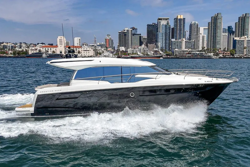 Slide: The Image of 2019 Prestige 520S yacht cruising in urban waterfront setting. - 4