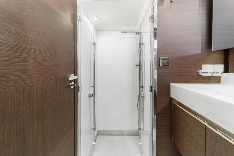 Slide: The Image of Luxurious bathroom interior of 2019 Prestige 520S yacht with modern shower and wooden accents. - 41