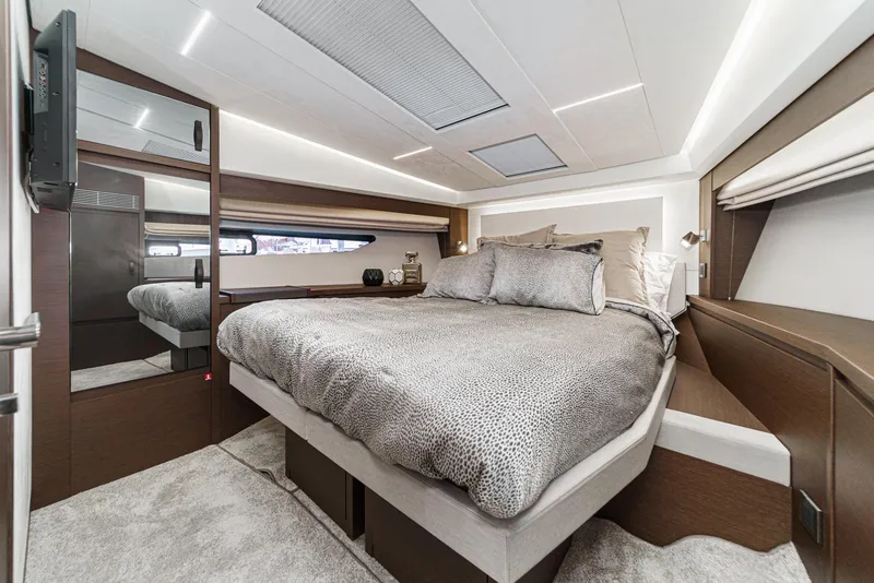 Slide: The Image of Luxurious bedroom interior of 2019 Prestige 520S yacht with modern design and elegant bedding. - 43