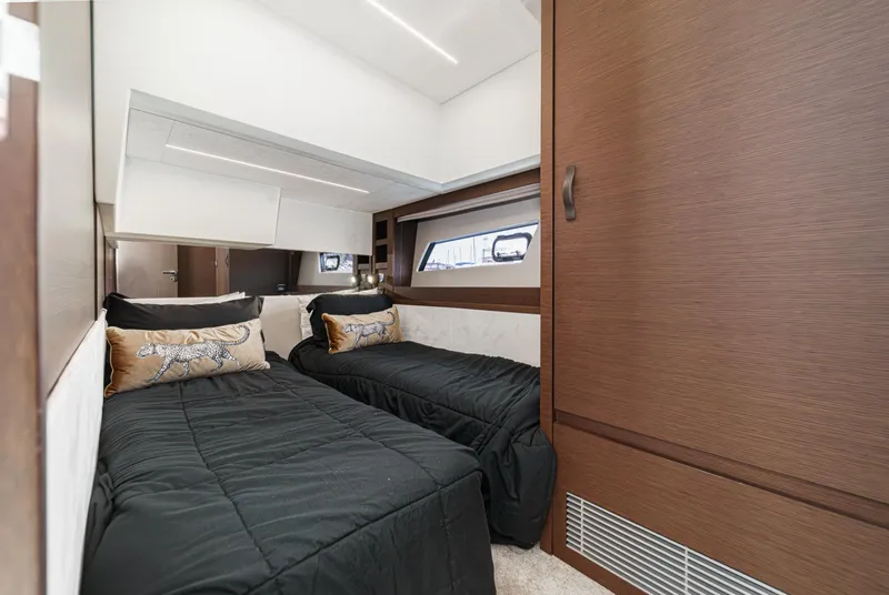 Slide: The Image of Luxurious twin cabin in 2019 Prestige 520S yacht with modern wood finishes. - 46