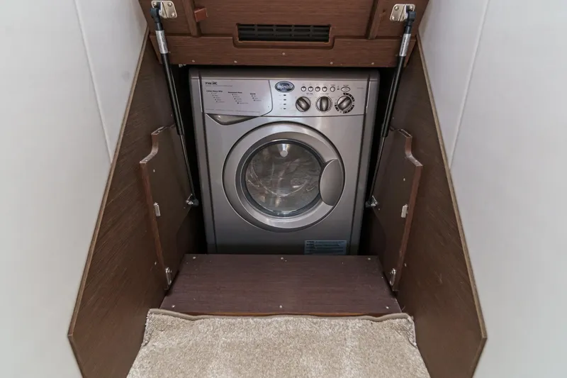 Slide: The Image of Compact washing machine in a 2019 Prestige 520S yacht's wooden cabinet. - 47