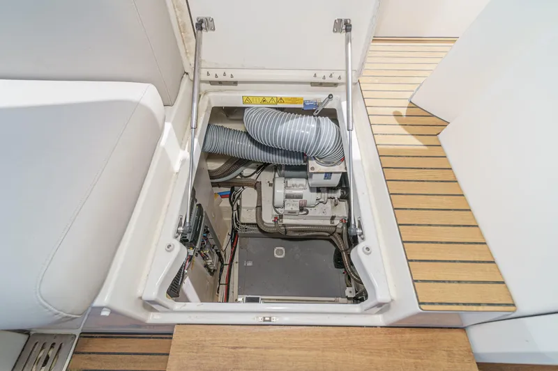Slide: The Image of Engine compartment of 2019 Prestige 520S yacht, showcasing mechanical components and ventilation system. - 48