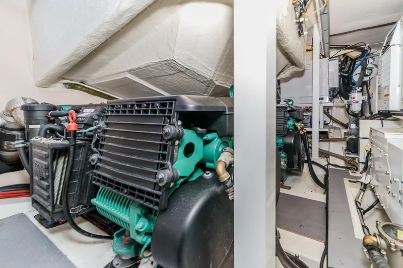 Slide: The Image of Engine room of 2019 Prestige 520S yacht, showcasing mechanical components and systems. - 49