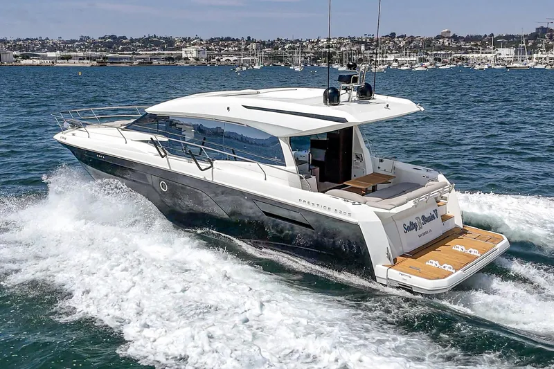 Slide: The Image of 2019 Prestige 520S yacht cruising on open water, showcasing sleek design and luxury features. - 9