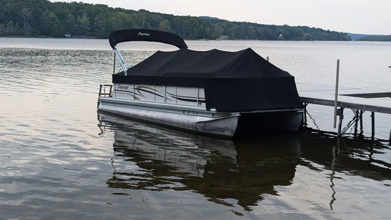 The Image of 2008 Premier 240 SunSpree pontoon boat docked on a calm lake. - 0