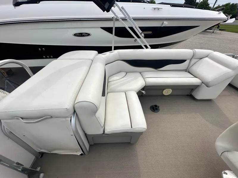 Slide: The Image of 2008 Premier 240 SunSpree boat with white leather seating and spacious deck area. - 6