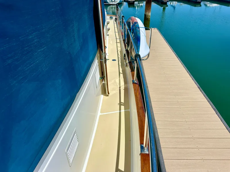 Slide: The Image of Side deck of 1994 Grand Banks 42 Classic yacht docked at marina. - 14