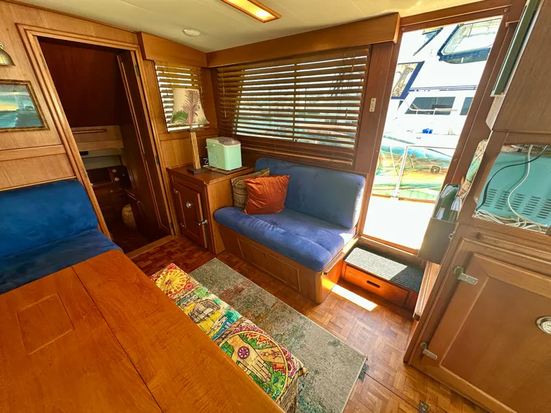 Slide: The Image of Interior of 1994 Grand Banks 42 Classic yacht with cozy seating and wooden accents. - 24