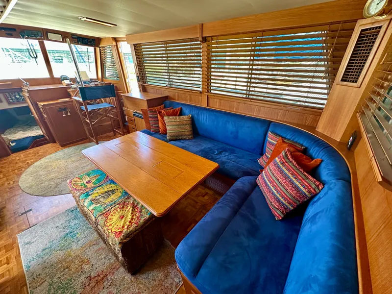 Slide: The Image of Luxurious interior of 1994 Grand Banks 42 Classic yacht with blue seating and wooden accents. - 26