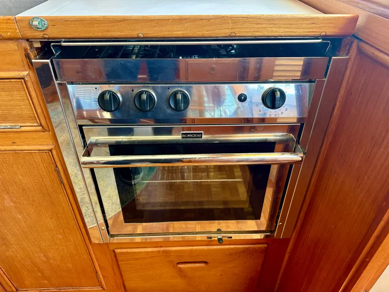 Slide: The Image of Stainless steel oven in a 1994 Grand Banks 42 Classic yacht kitchen. - 35