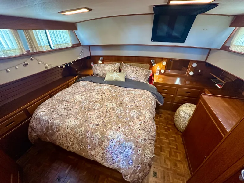 Slide: The Image of Cozy bedroom in 1994 Grand Banks 42 Classic yacht with elegant wood finish. - 40