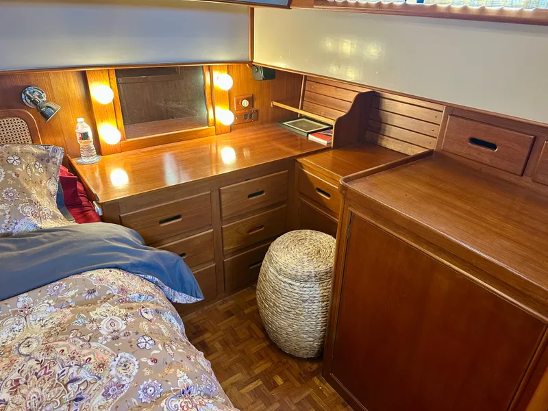 Slide: The Image of Cozy cabin interior of 1994 Grand Banks 42 Classic with wooden desk and bed. - 44