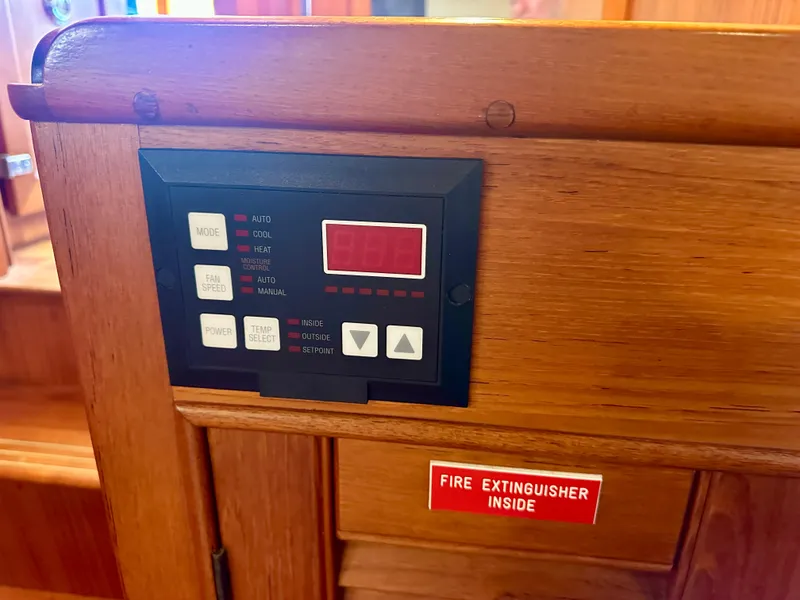 Slide: The Image of Control panel on 1994 Grand Banks 42 Classic boat with fire extinguisher sign. - 45