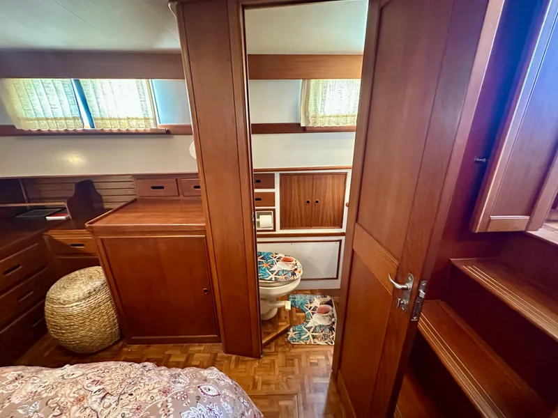 Slide: The Image of Interior of 1994 Grand Banks 42 Classic yacht with wooden cabinetry and cozy decor. - 47