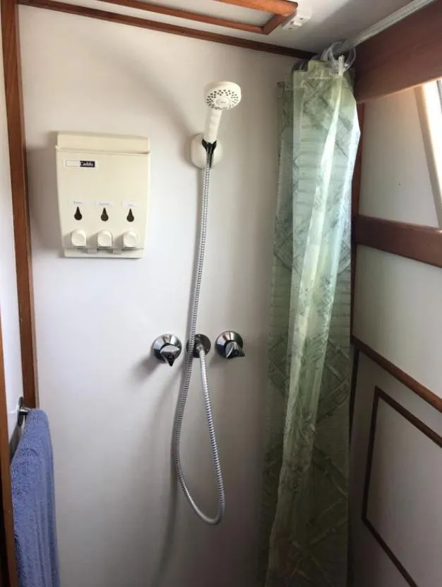 Slide: The Image of Shower area in 1994 Grand Banks 42 Classic yacht with dispenser and curtain. - 49