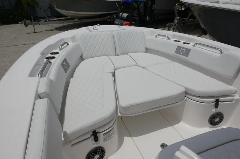 Slide: The Image of 2025 Sea Fox 248 Commander boat with white cushioned seating area. - 19