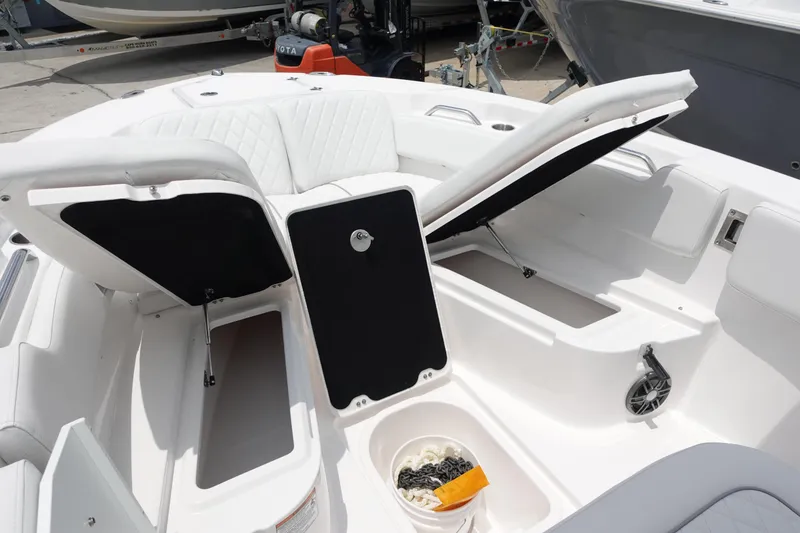 Slide: The Image of 2025 Sea Fox 248 Commander boat interior with open storage compartments and seating. - 21