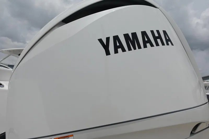 Slide: The Image of Yamaha engine on 2025 Sea Fox 248 Commander boat, cloudy sky background. - 29