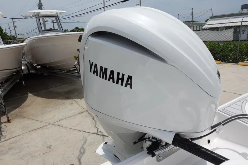 Slide: The Image of Yamaha outboard motor on 2025 Sea Fox 248 Commander boat, parked on concrete. - 30