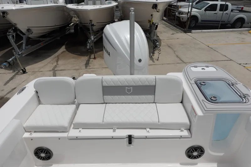 Slide: The Image of 2025 Sea Fox 248 Commander boat interior with cushioned seating and Yamaha engine. - 5