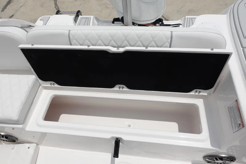 Slide: The Image of 2025 Sea Fox 248 Commander boat storage compartment with open lid, showcasing spacious interior. - 7