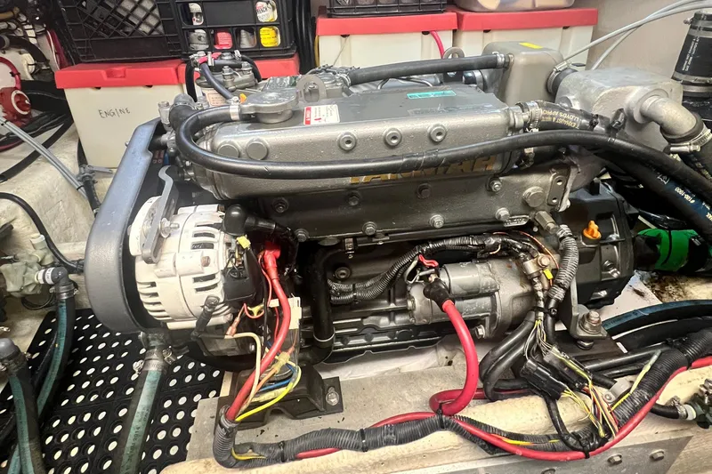 Slide: The Image of Engine room of a 2006 Great Harbour N37 boat, showcasing detailed engine components. - 11