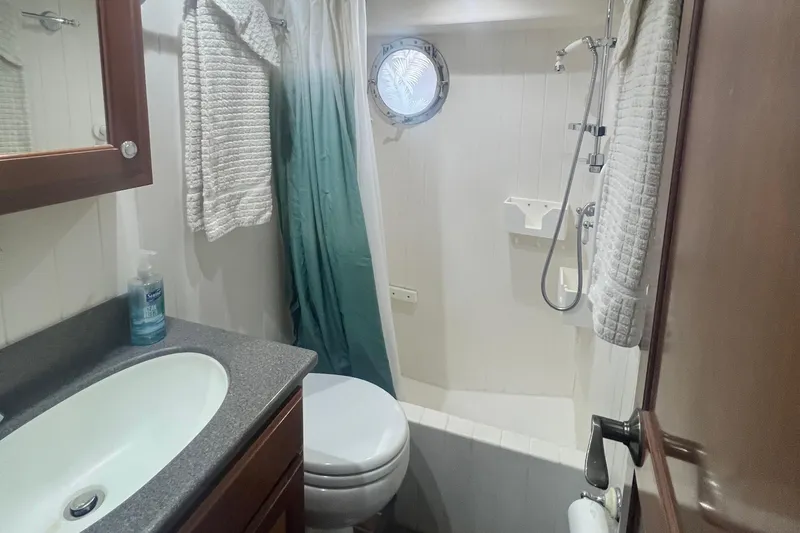 Slide: The Image of Bathroom interior of 2006 Great Harbour N37 boat with shower and sink. - 15