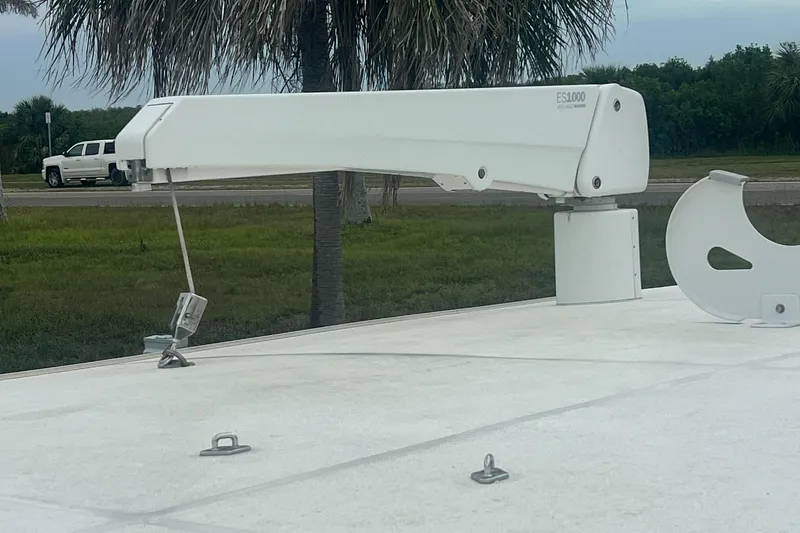 Slide: The Image of 2006 Great Harbour N37 boat deck with davit system and lush greenery background. - 7