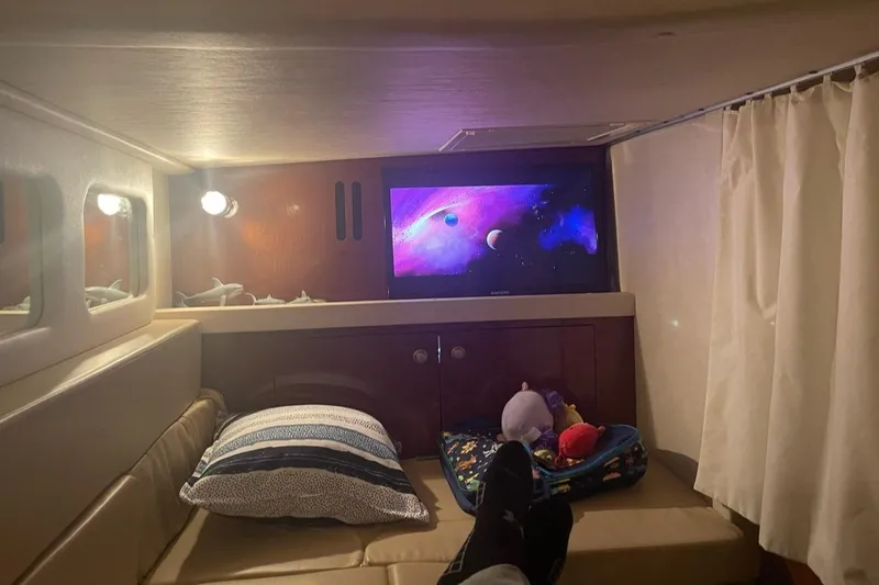 Slide: The Image of Cozy cabin interior of 2008 Sea Ray 330 Sundancer with TV and comfortable seating. - 14