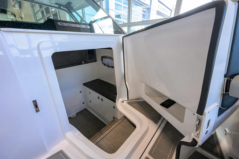 Slide: The Image of Interior cabin of 2026 Monterey Elite 30 OB boat, featuring sleek design and modern amenities. - 11