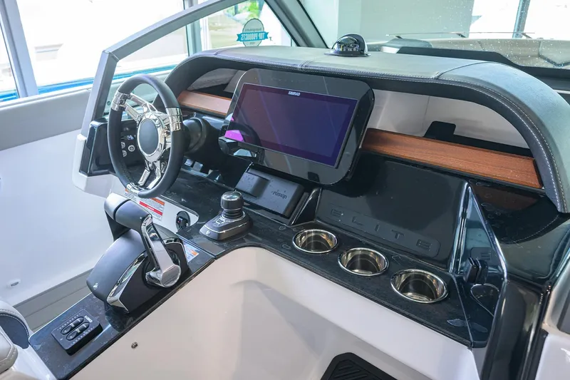 Slide: The Image of 2026 Monterey Elite 30 OB boat dashboard with modern controls and touchscreen display. - 19
