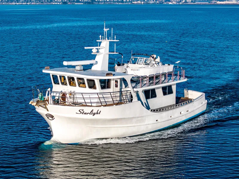 The Image of Custom Expedition Vessel 58, 1986, cruising on blue ocean waters. - 0