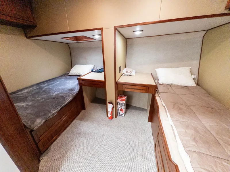 Slide: The Image of Two cozy single beds in a 1986 Custom Expedition Vessel 58 cabin. - 26