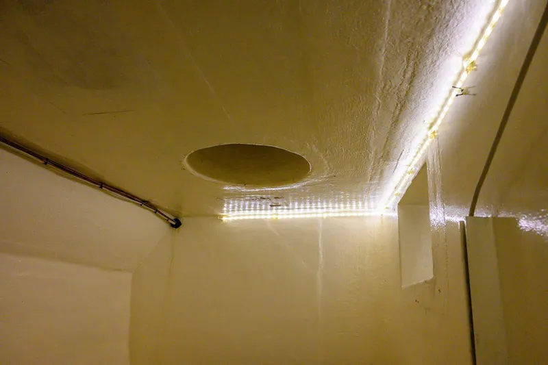 Slide: The Image of Interior of 1986 Custom Expedition Vessel 58 with LED lighting and ceiling details. - 29