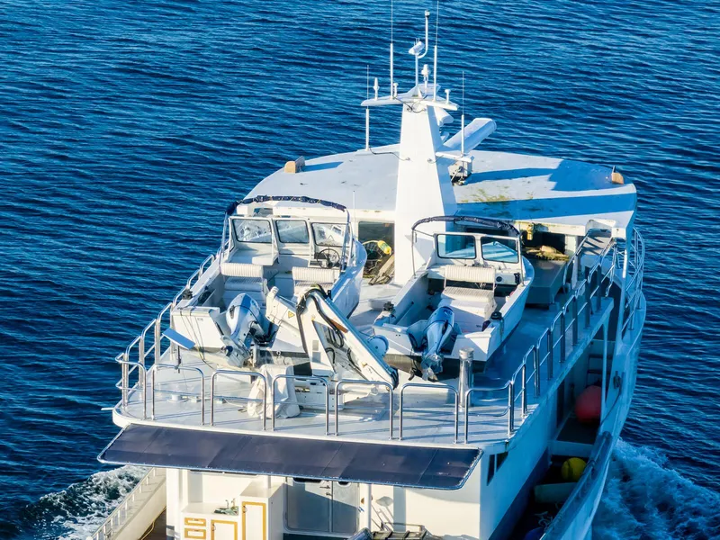 Slide: The Image of Custom Expedition Vessel 58, 1986, cruising on blue ocean waters. - 3